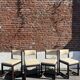 Many mid-century vintage wooden and fabric chairs.