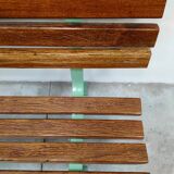 Restored and varnished garden bench in hardwood and olive green metal