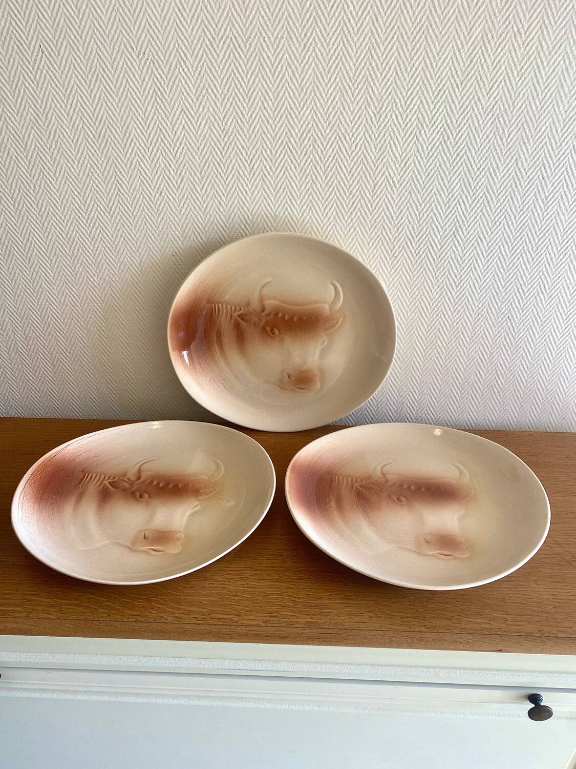 Saint Amand plates with cow head decoration.