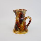 Beautiful ceramic pitcher in fire colors
