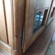 Showcase library with two sections in solid oak.