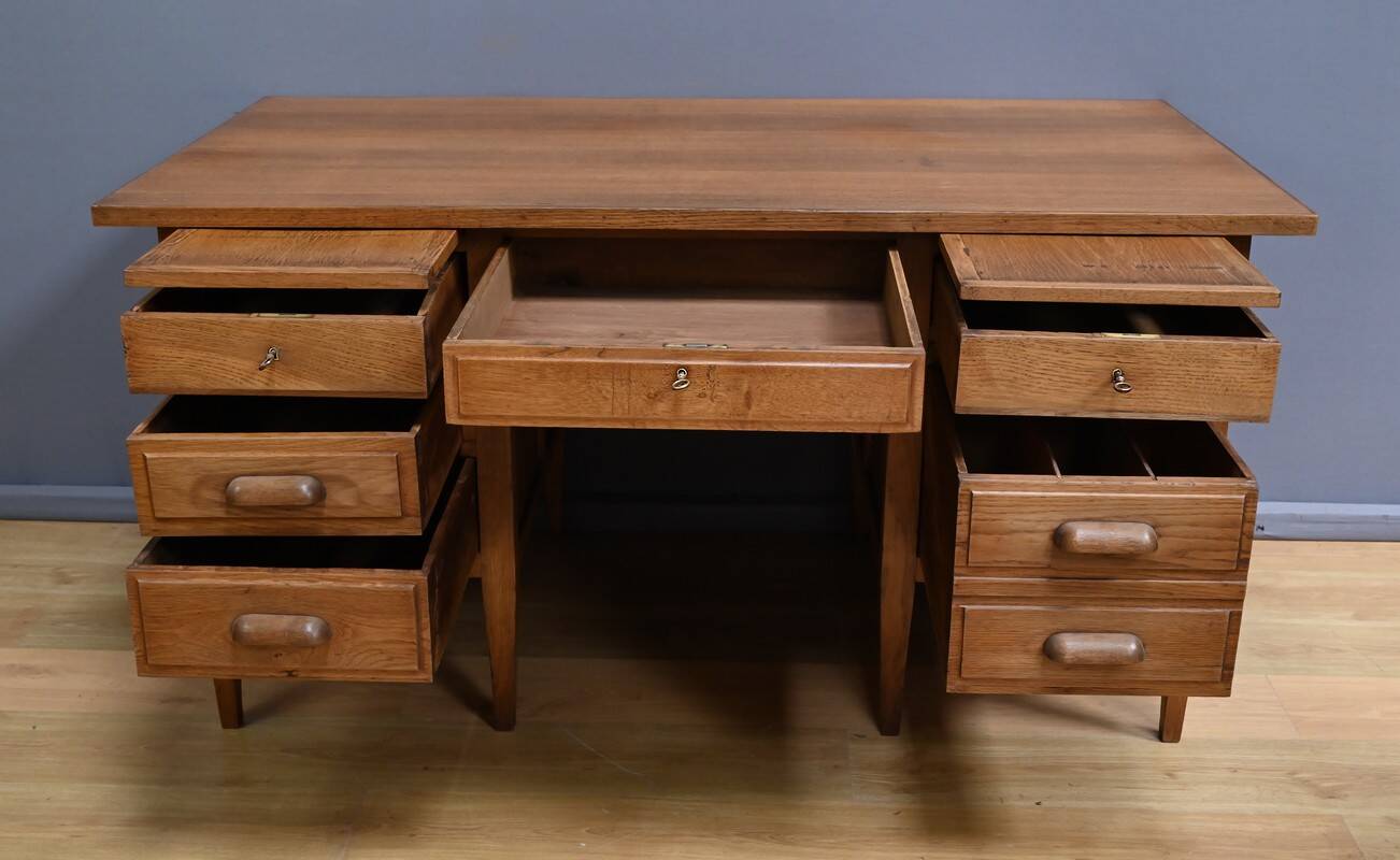 Solid oak pedestal desk, Régy establishments – 1940