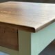 Restored antique oak bedside table - almond green and natural varnished wood