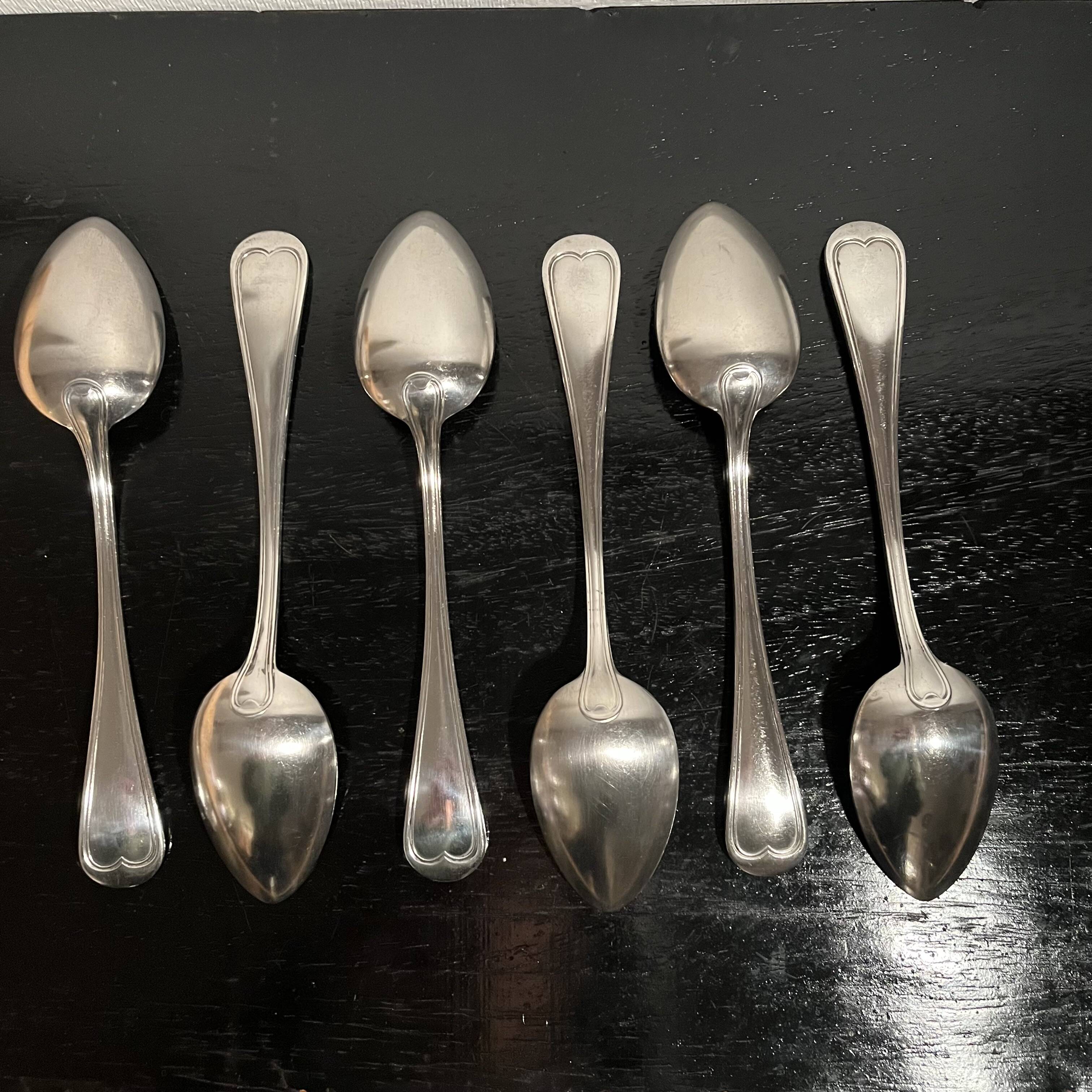 Silver-plated metal soup spoons