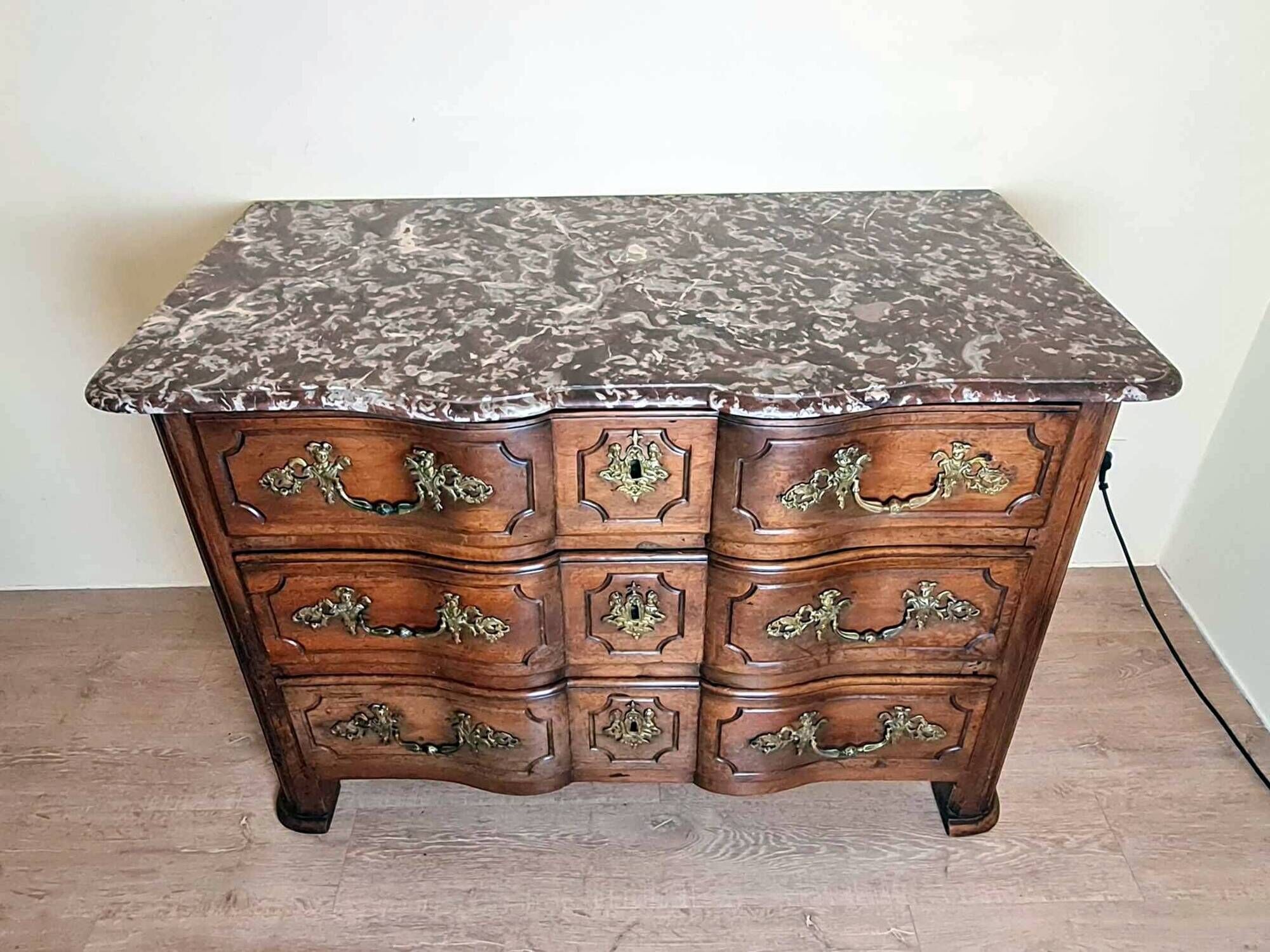 Louis XIV period Arbalette chest of drawers in solid walnut circa 1700