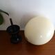 Ostrich egg on blackened wooden base - object of curiosity