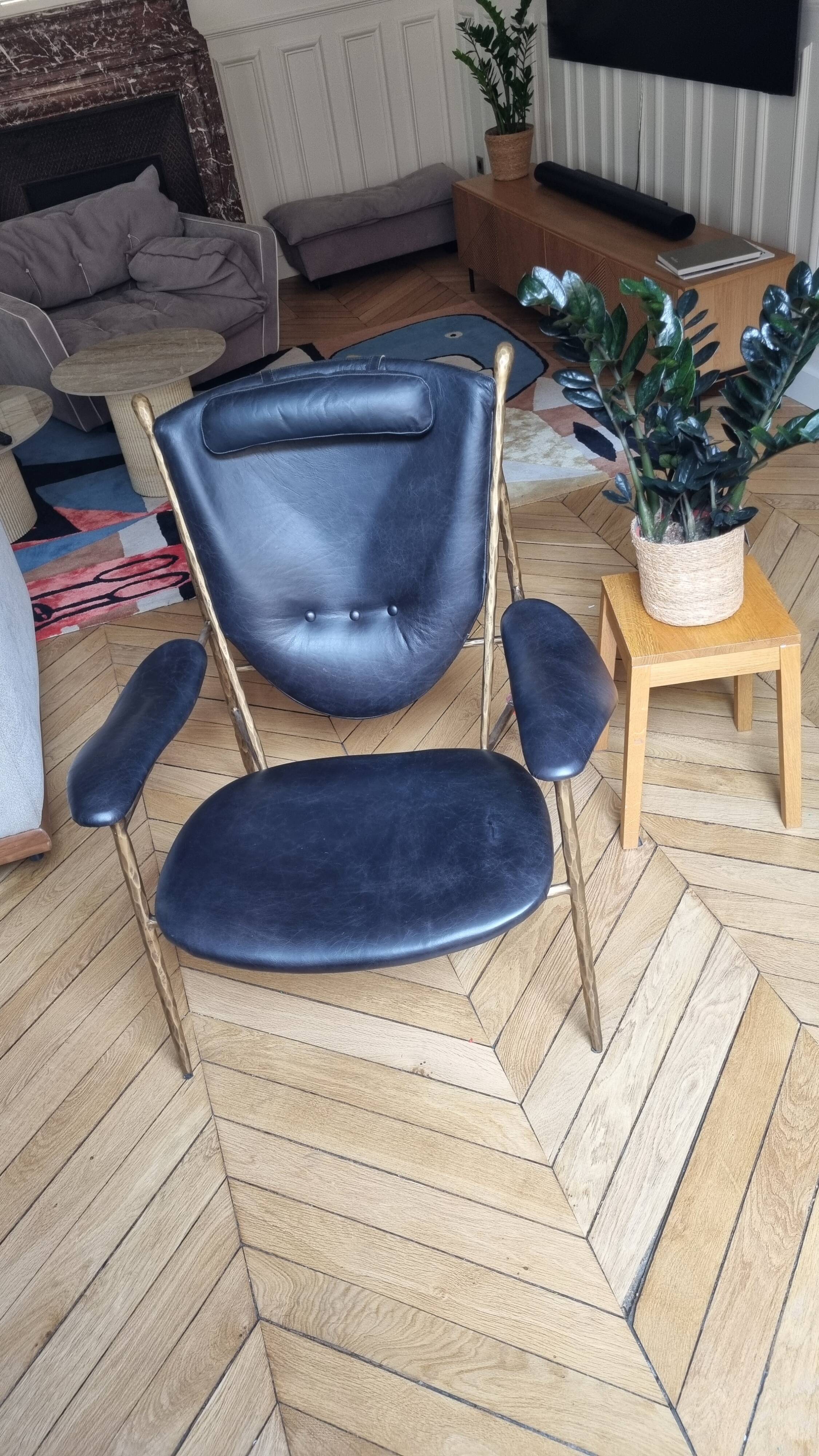 Black and golden bronze designer armchair