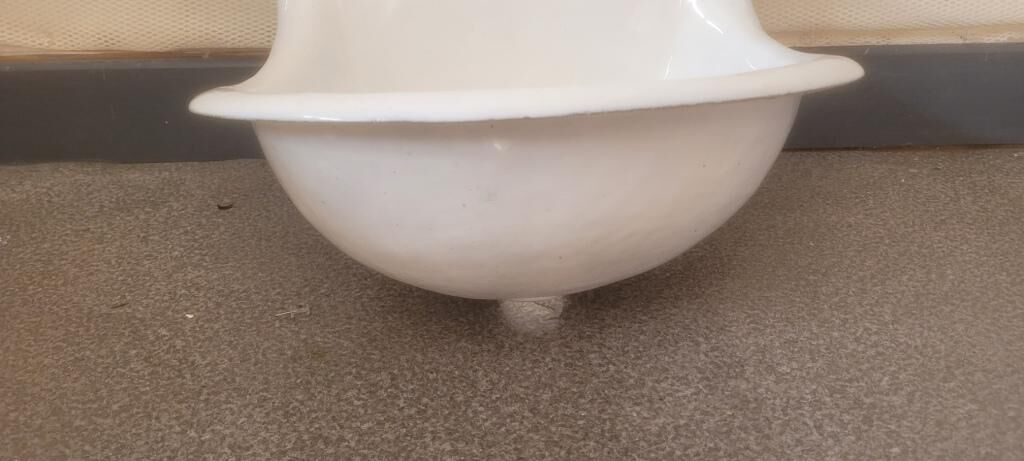 Old wall fountain washbasin