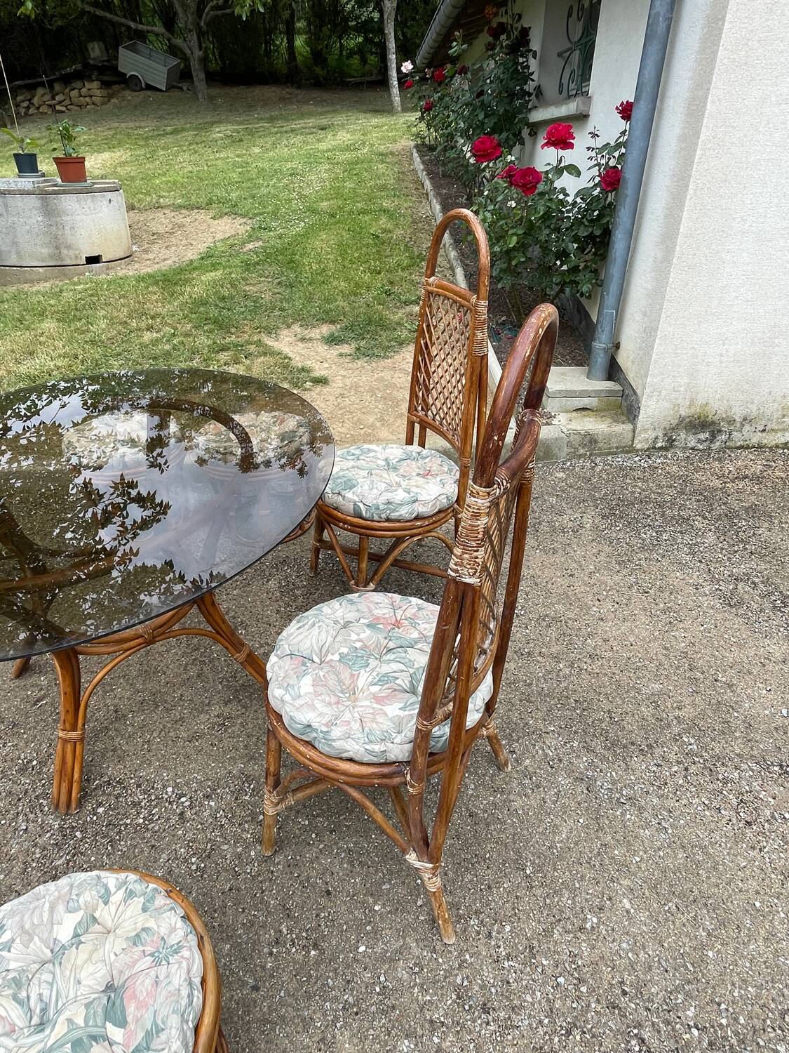 Vintage rattan dining set with glass table, 4 chairs and 4 stools.