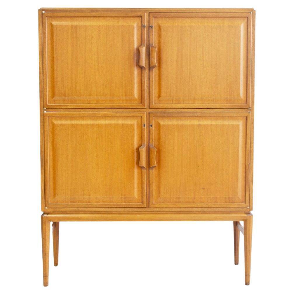 Large Swedish mahogany storage unit with four front doors.
