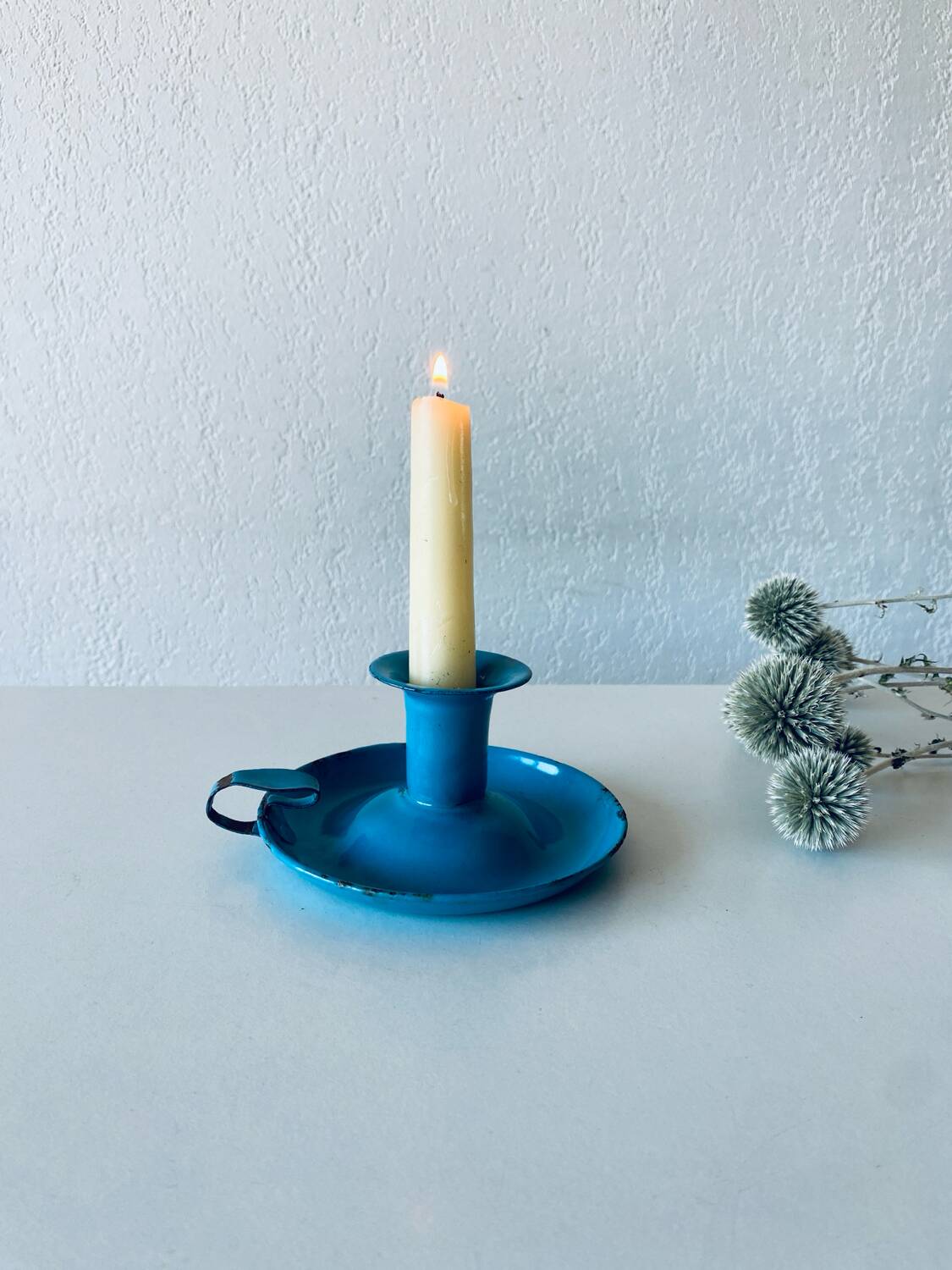 Antique enamelled metal candle holder
