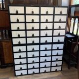 Large black and white industrial chest of drawers in pine, 40 drawers, 1950s.