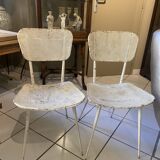 Pair of white metal chairs