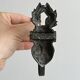 Antique black patinated metal coat hook.