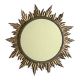 Sun mirror decorated with golden leaves, circa 1950.