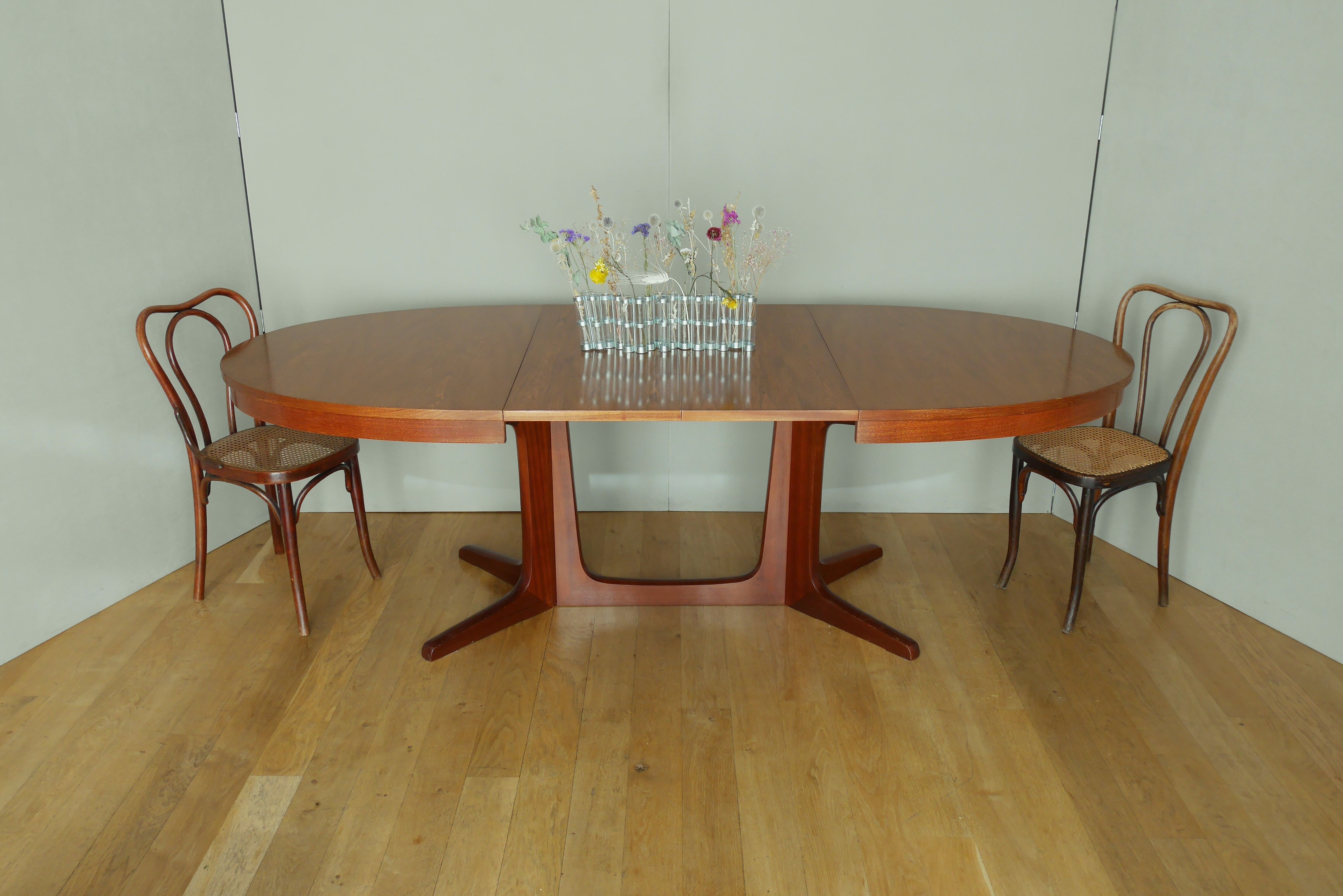 Scandinavian style oval table in central foot with extensions