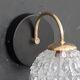Globe wall light in moulded glass, brass swan collar, circa 1950