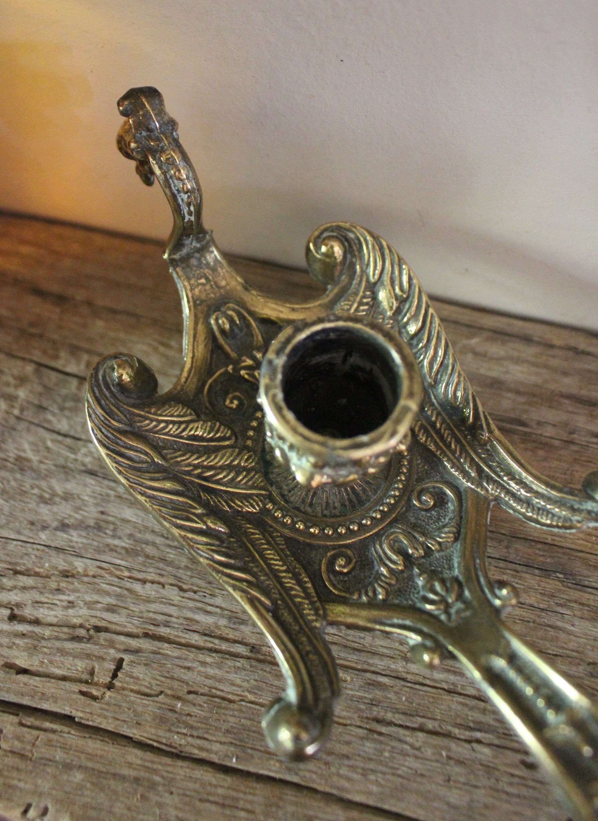 Brass candle holder cave rat peacock