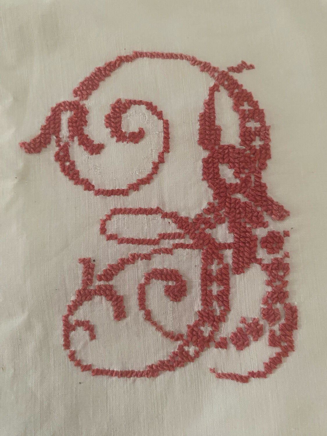 Antique white cotton pillowcase with crochet and monogram.