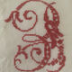 Antique white cotton pillowcase with crochet and monogram.