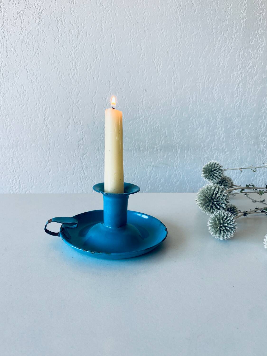 Antique enamelled metal candle holder