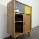 Modernist sideboard with glass doors in grey and yellow oak veneer.