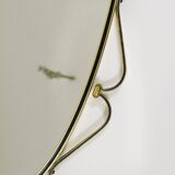 Elegant wall mirror in brass and black from the mid-century, Italy, 1950s.