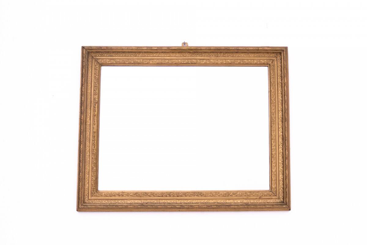 Miroir dans un cadre décoratif en or, Pologne, début du XXe siècle.