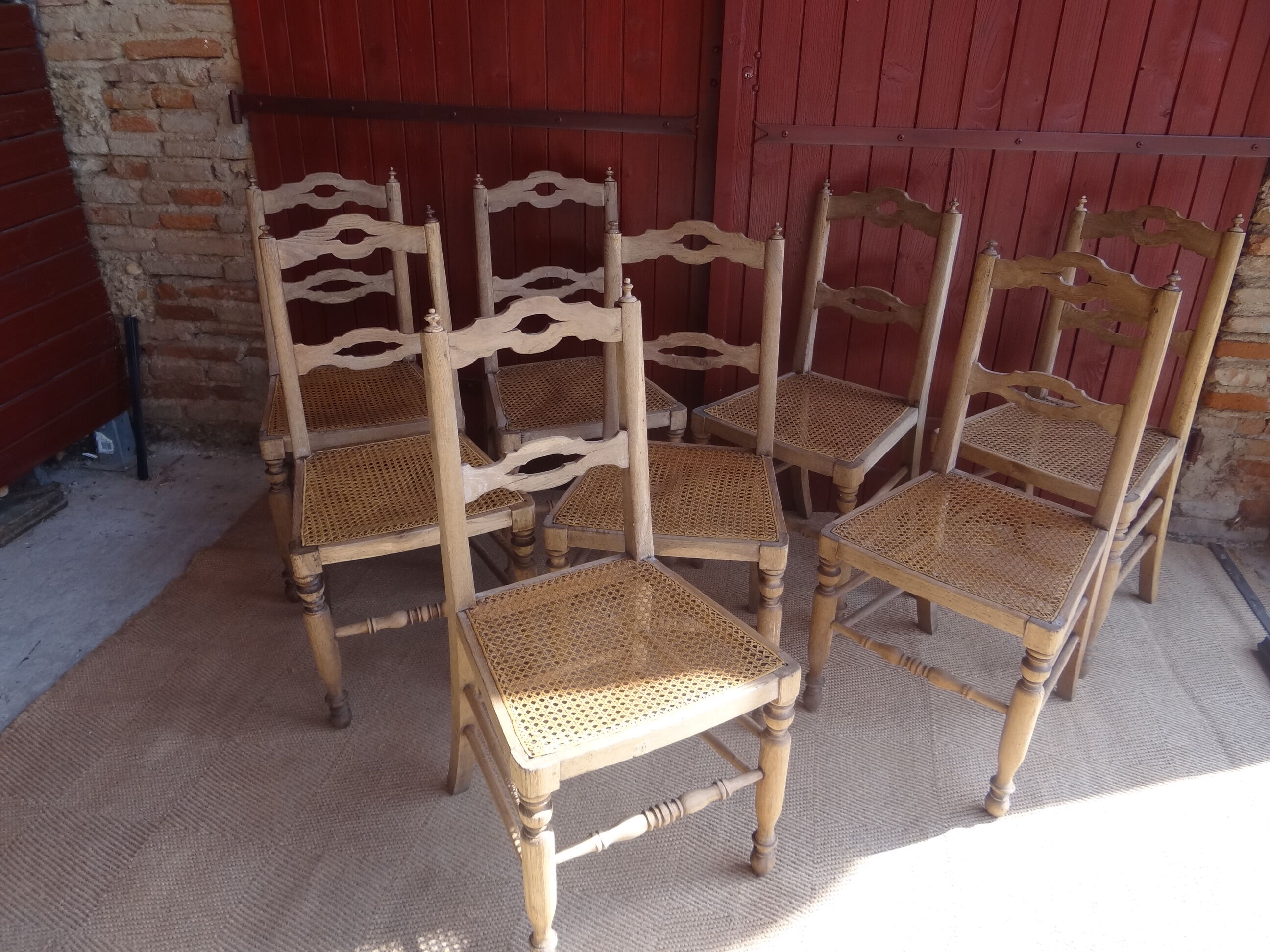 Suite of oak chairs; canated seats