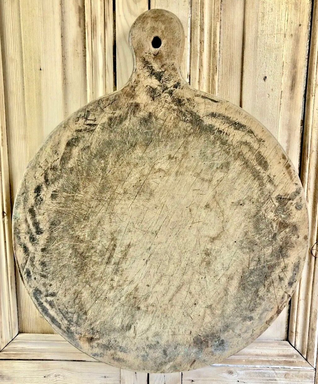 Old large round pizza cutting board