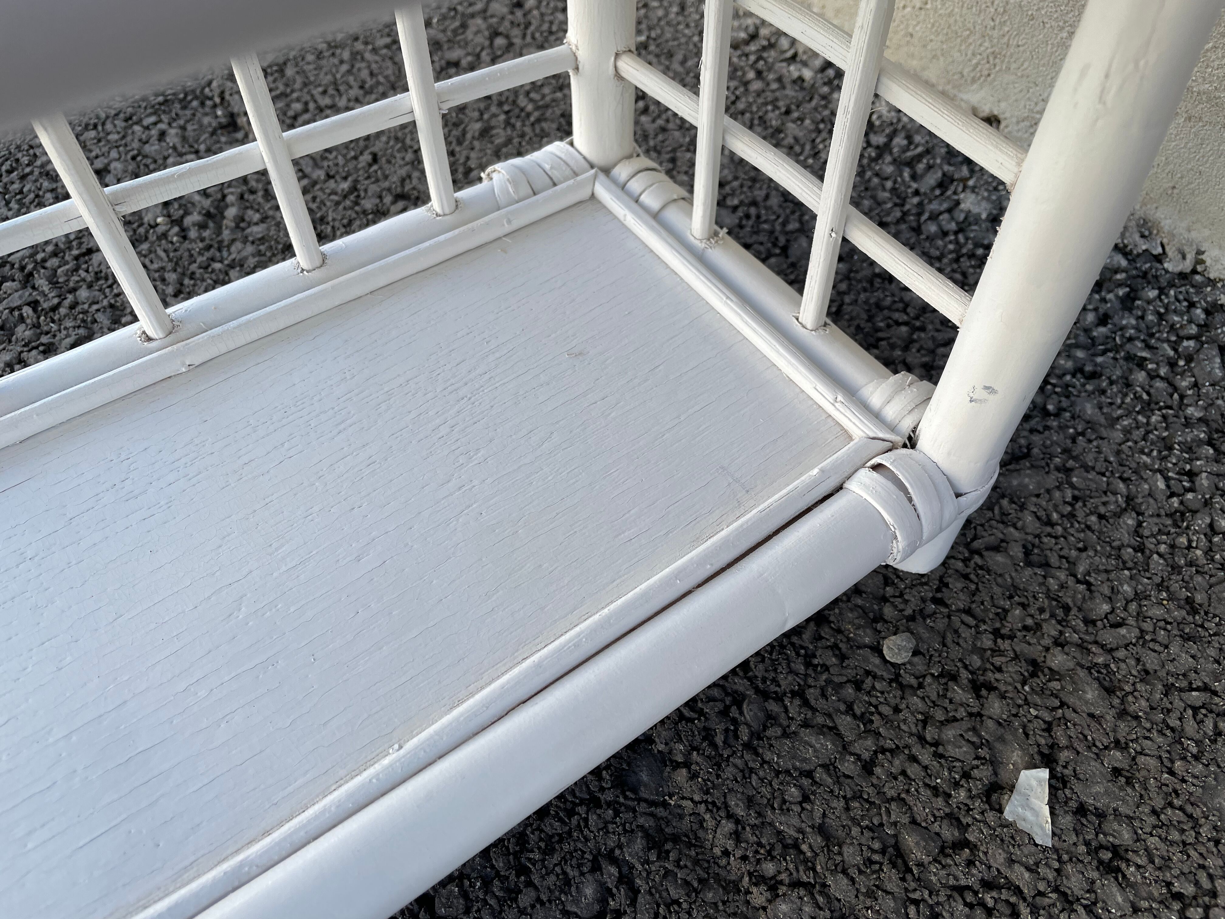 White rattan shelf with braces