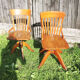2 old swivel office chairs in solid wood
