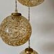 Suspension cascade trois feux globes vintage en verre ambré