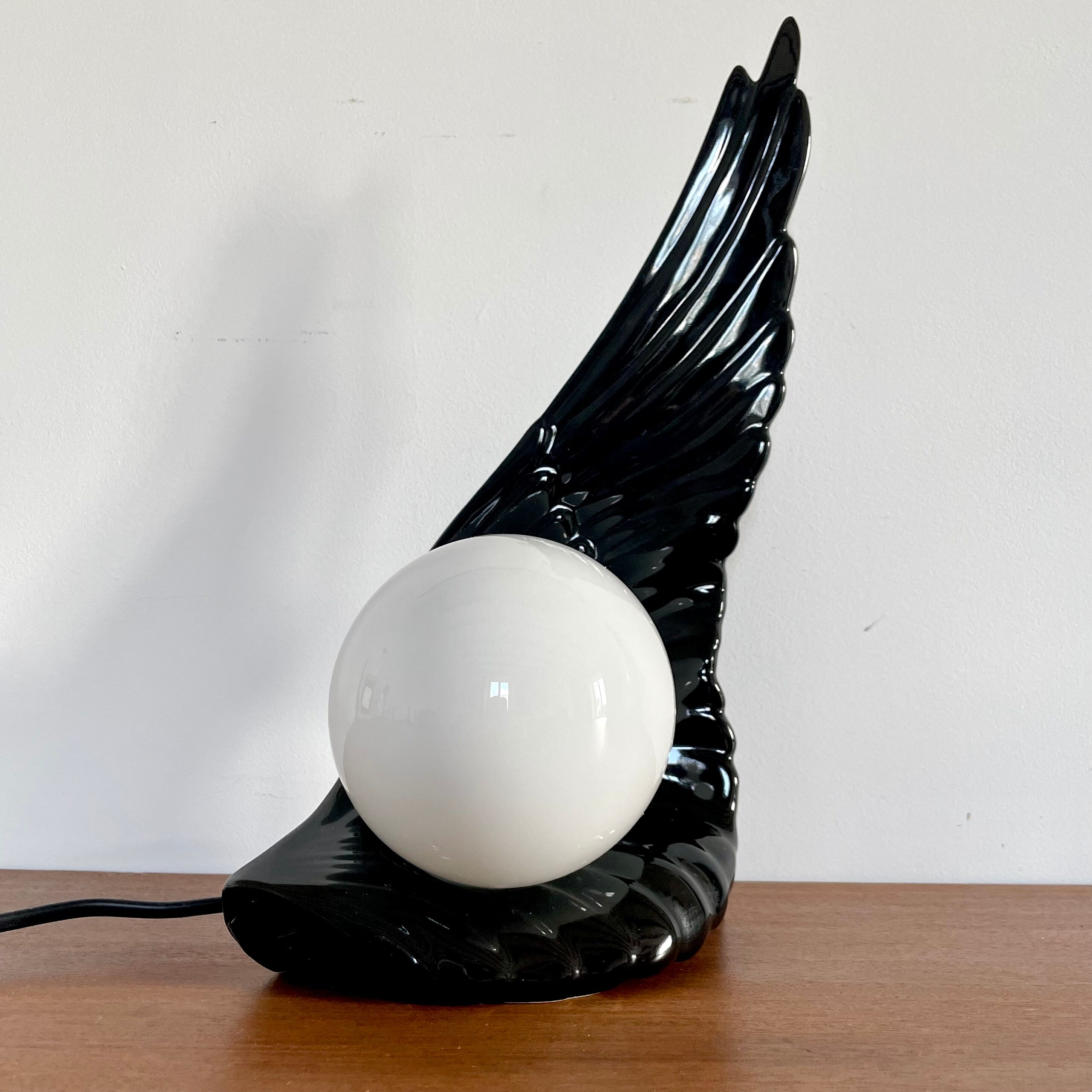 Ceramic wing and globe lamp