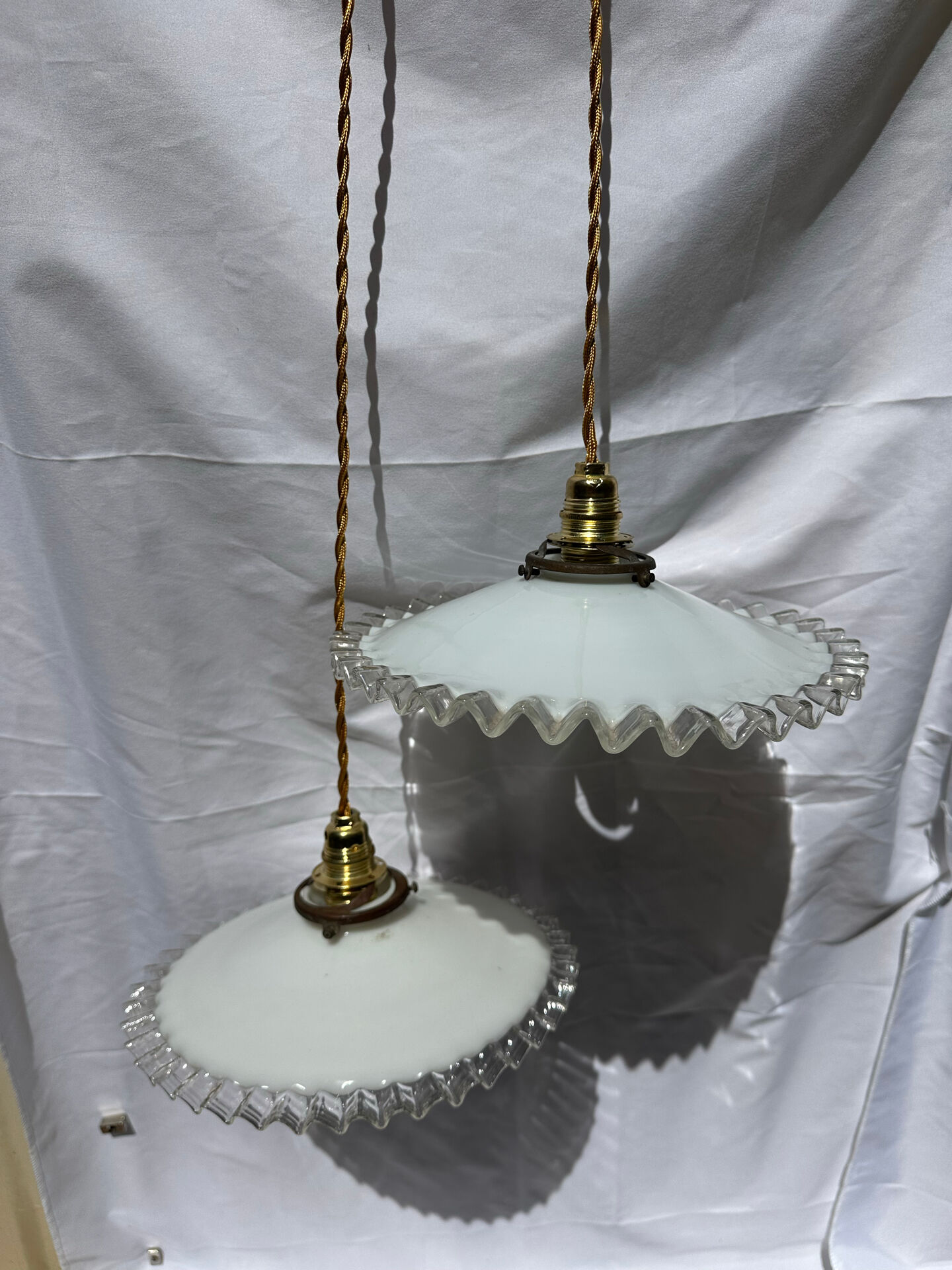 Vintage wavy opaline suspension pair with brass claw