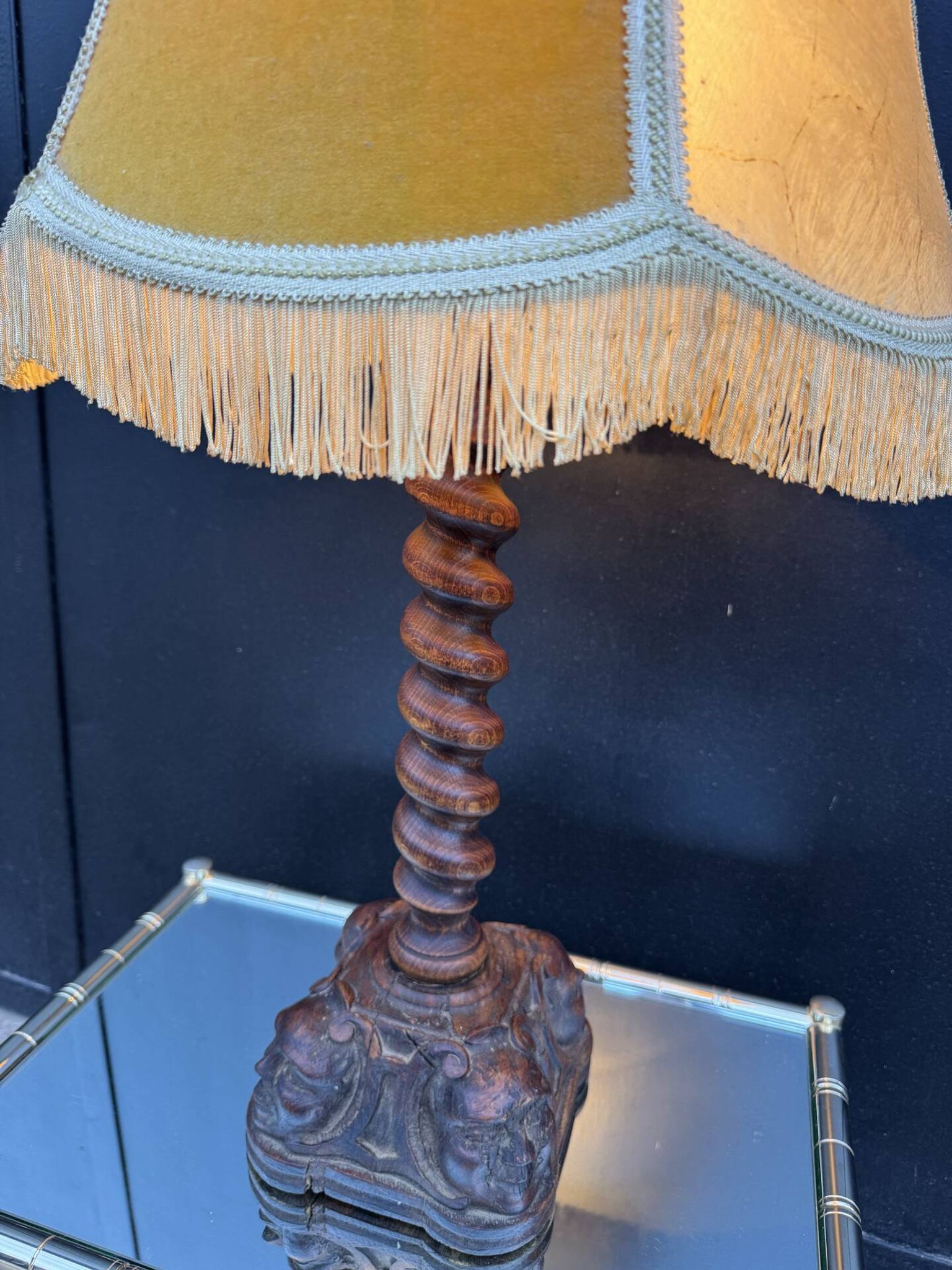 Sculpted wooden lamp with faces, antique.