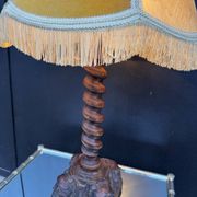 Sculpted wooden lamp with faces, antique.