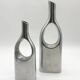Pair of "drop" vases in aluminium cast, Italy, 1970s