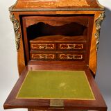 Curved secretary and inlaid with floral branches in Louis XV style