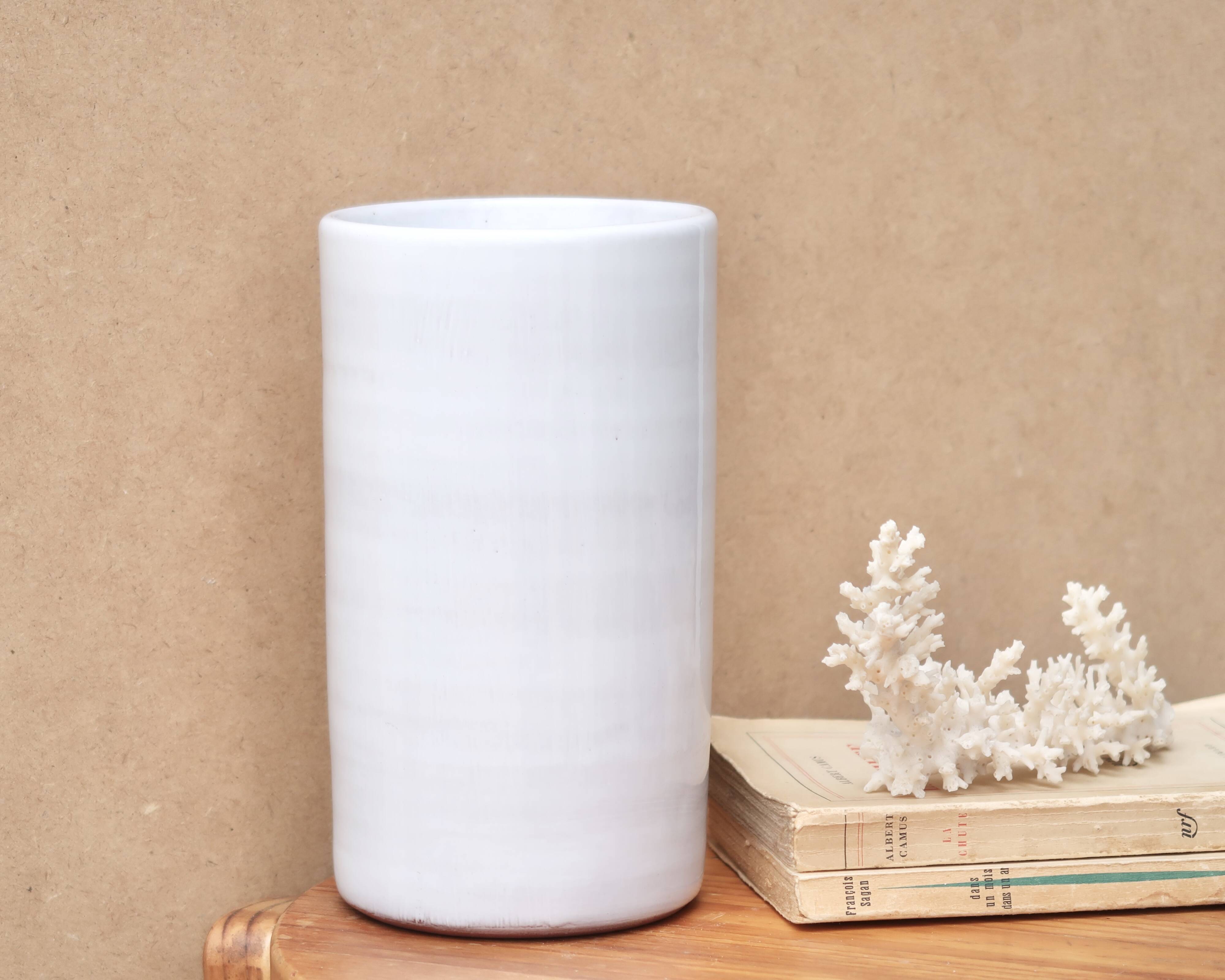 Vase by Antonio Lampecco minimalist white ceramic scroll