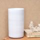 Vase by Antonio Lampecco minimalist white ceramic scroll