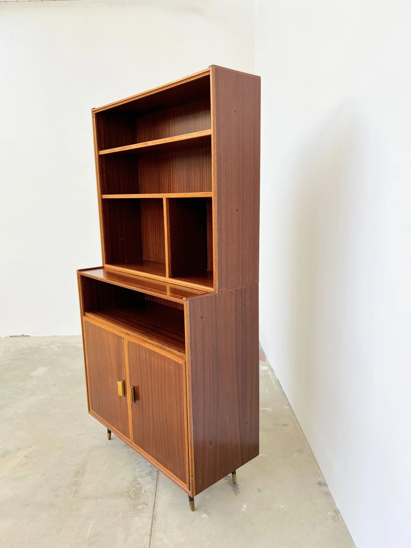 Mahogany library — closed storage and open cubbies, custom-made, 1960s.
