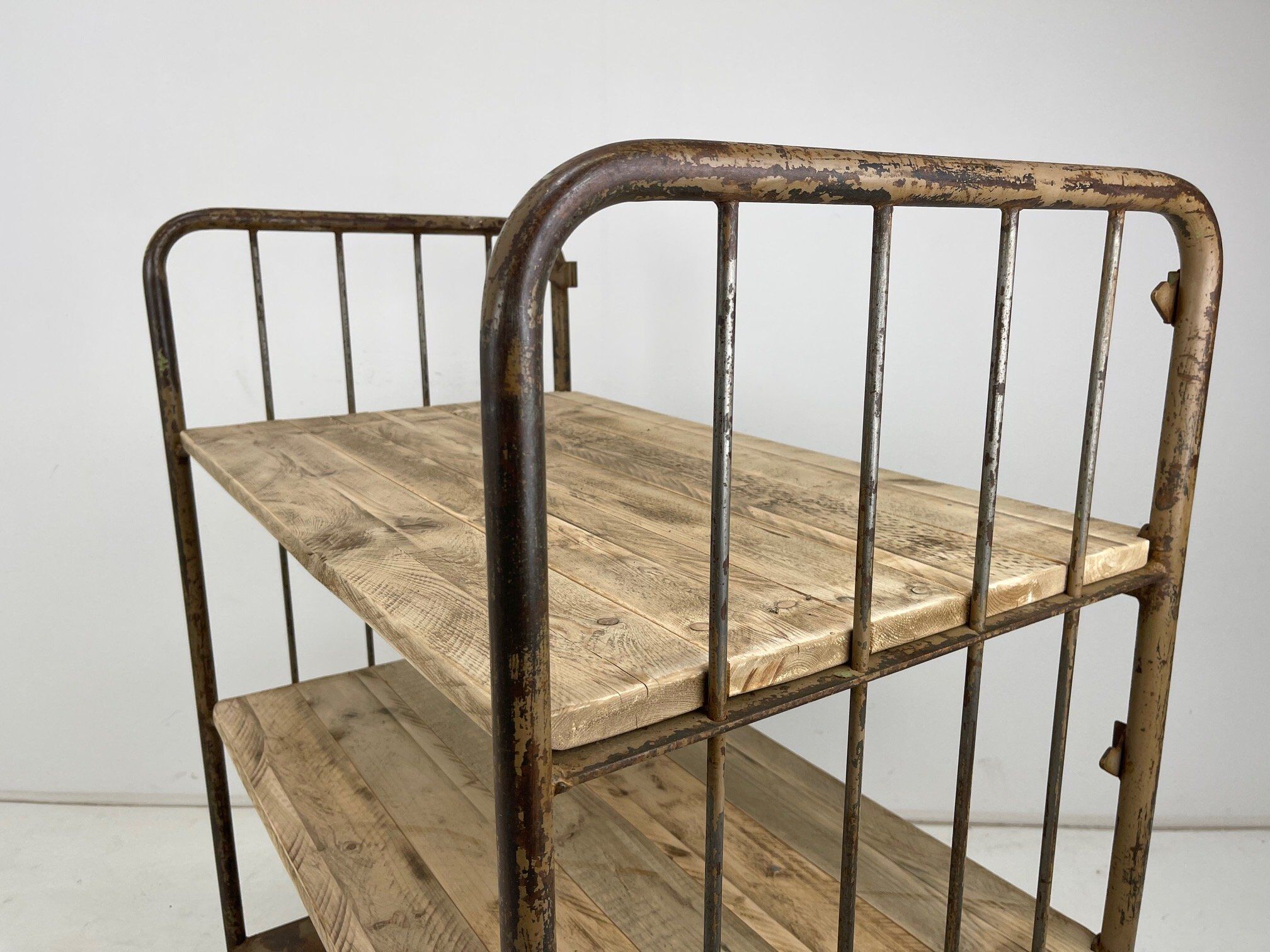 Vintage industrial iron and wood shelves on wheels