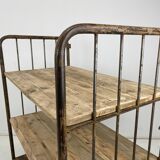 Vintage industrial iron and wood shelves on wheels