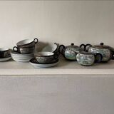 CHINA, 20th century Part of a porcelain tea service with polychrome decoration of palace scenes and v