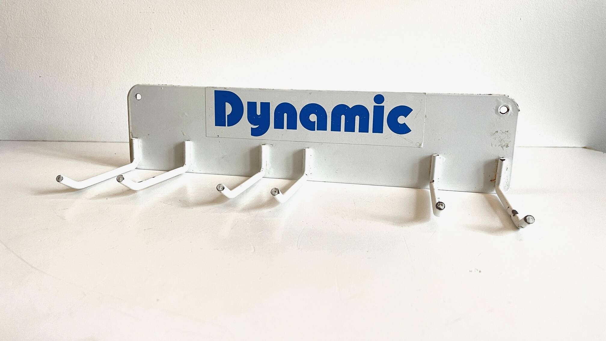 Vintage white metal wall trade coat rack