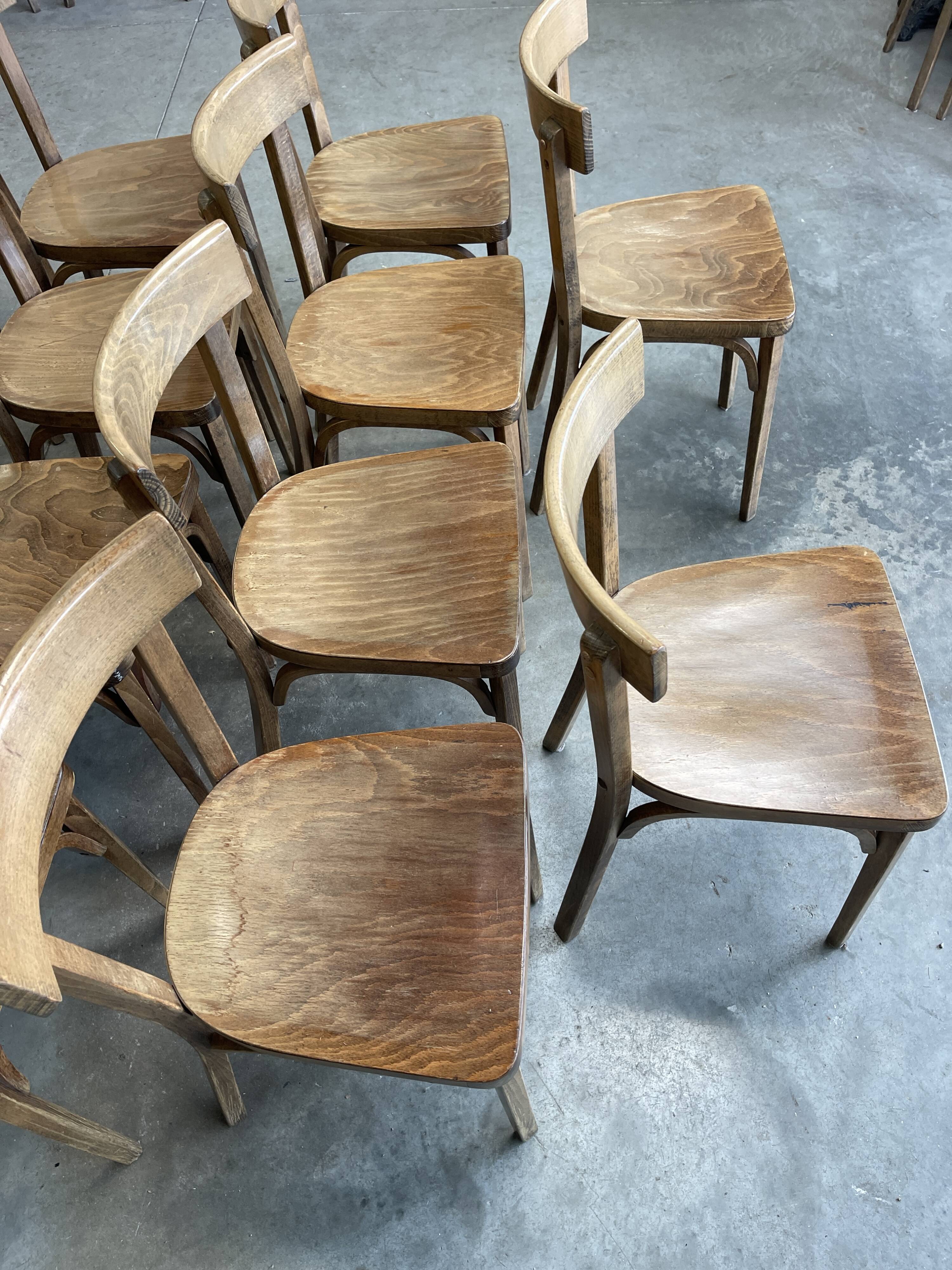 Set of 26 Baumann wooden bistro chairs from the 1950s France