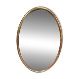 Oval mirror in gilded wood