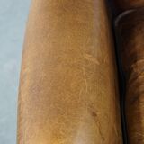 Sheep leather wingback chair finished with black piping