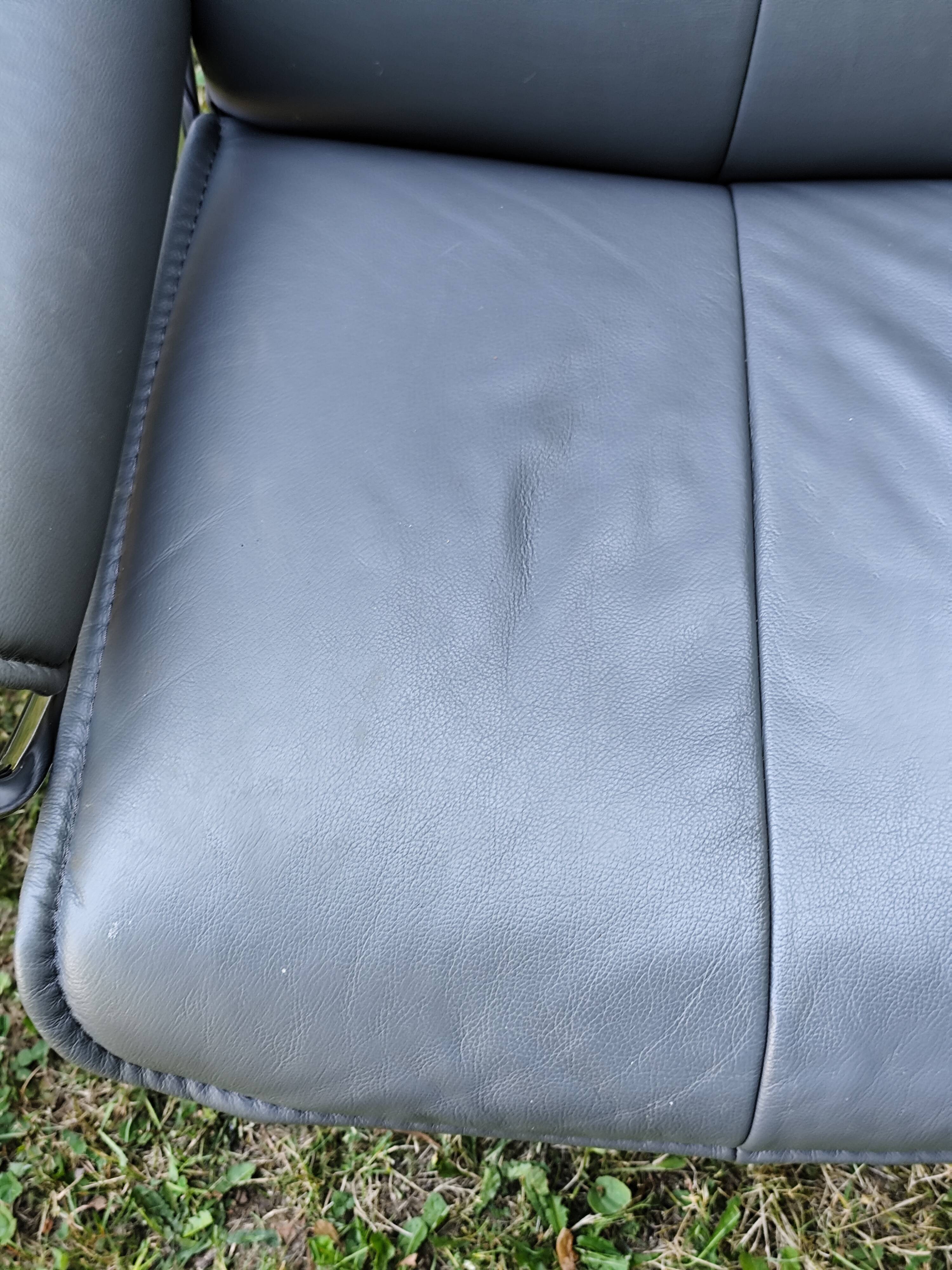 Stressless City armchair with footrest/ottoman, grey